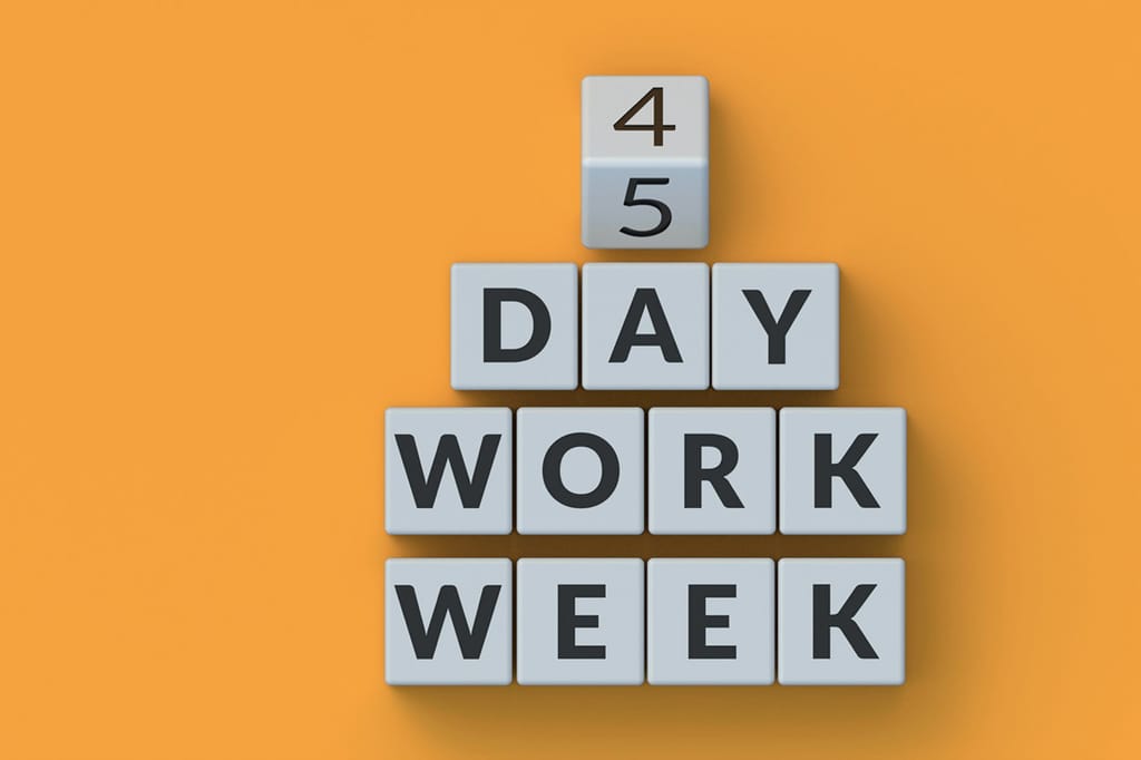 A picture of blocks with letters changing to 4 day work week benefits.