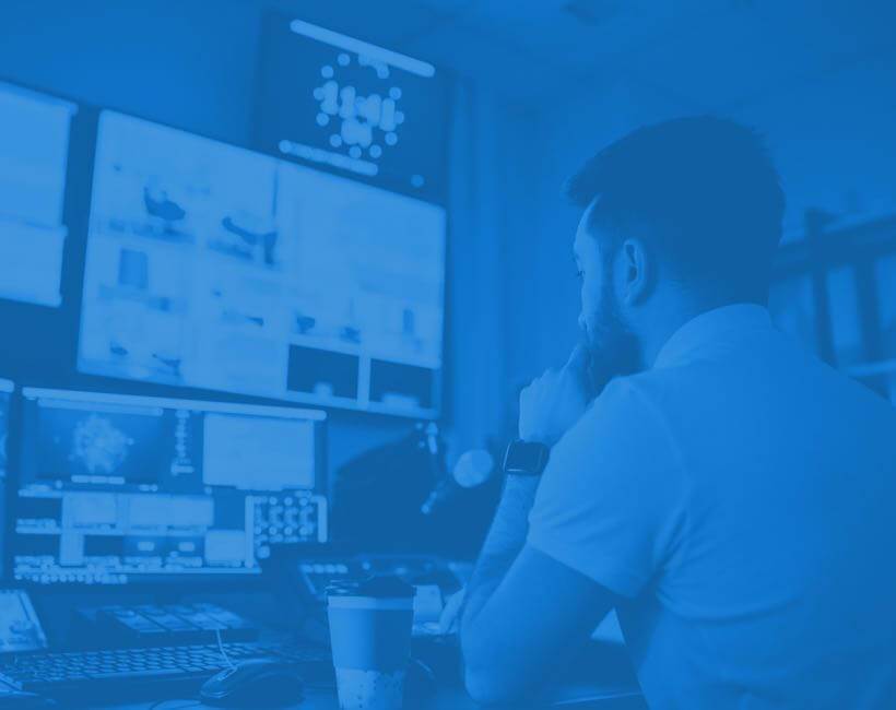 person working at his desk - blue overlay