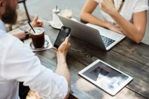 Remote employees working on laptops and tablets