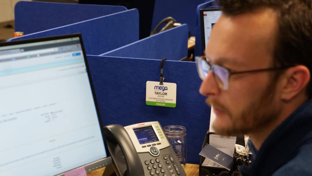 Taylor sits at his desk at ActivTrak