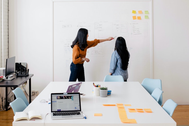 two woman working in an office together