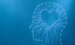 Silhouette of a head with a heart inside to signal leading with empathy.
