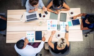 A group of employees collaborating and being productive in the workplace.