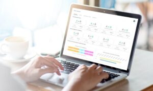 Person looking at ActivTrak’s impact analysis report on a laptop.