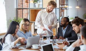 A team meeting to discuss what a business can do to improve its productivity.