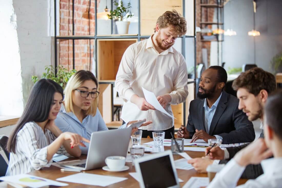 A team meeting to discuss what a business can do to improve its productivity.