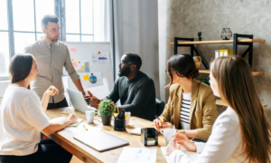 An in-office team discussing office strategy during a crisis.