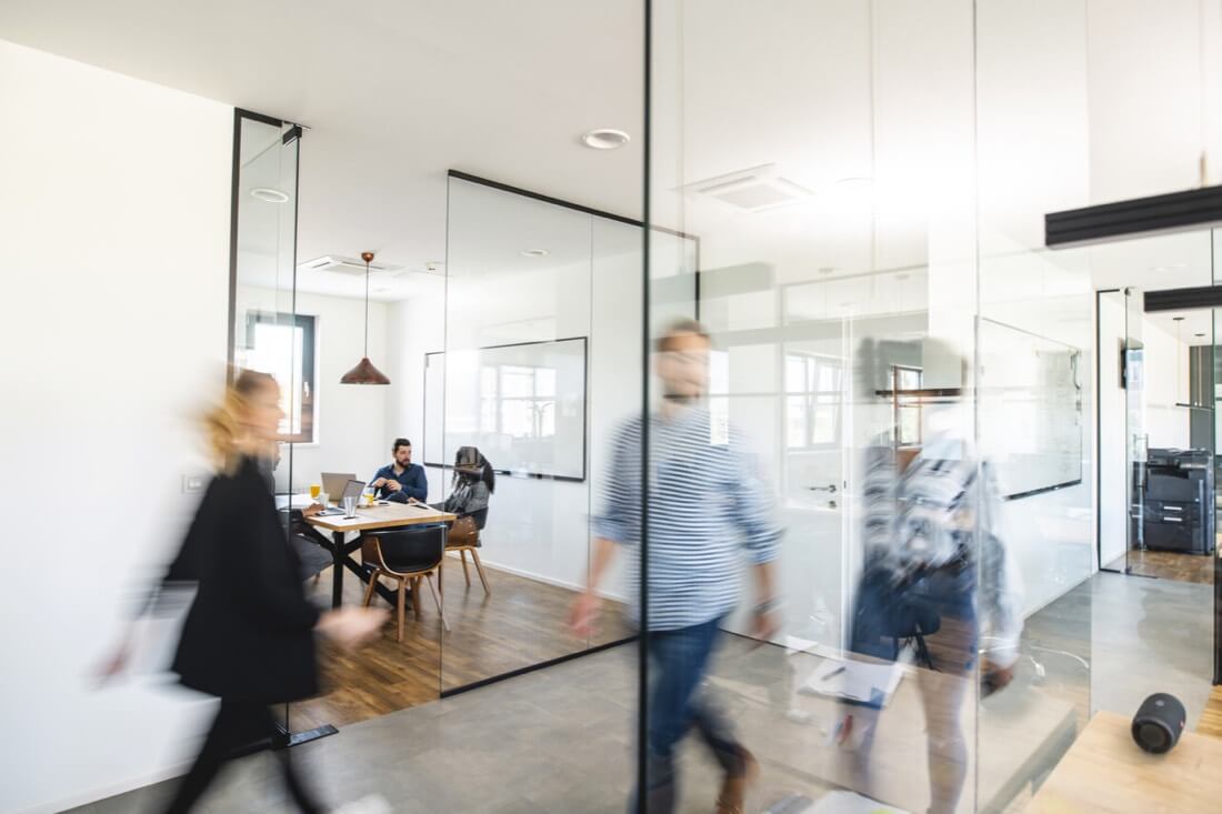 Office with employees in a dynamic workplace.