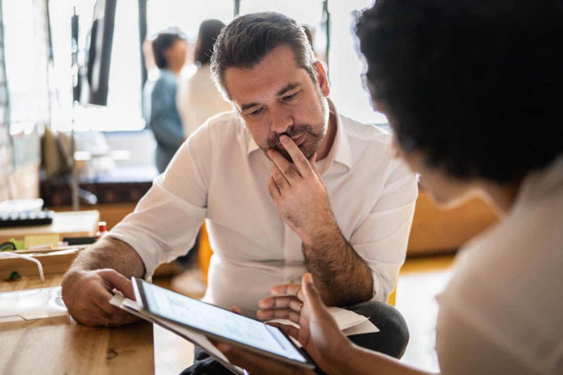 two colleagues conducting a workforce planning audit.