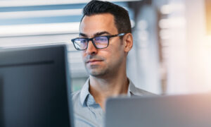 A team leader using workforce management software to manage his team.