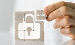 Blocks stacked to form a lock to symbolize employee privacy.