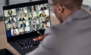 A team on a zoom call discussing solutions to the challenges of virtual teams.