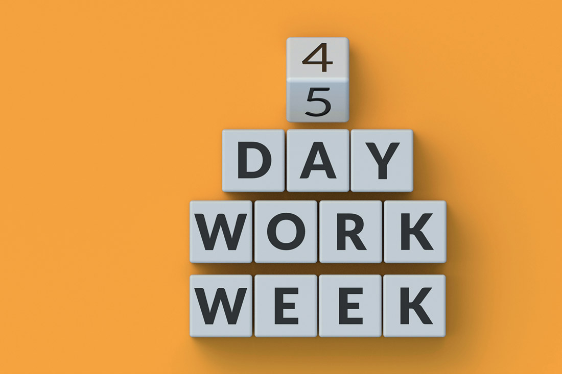 A picture of blocks with letters changing to 4 day work week benefits.