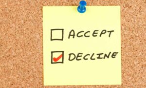 Sticky note posted on a message board with options to accept or decline, with decline checked.