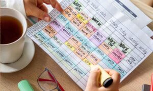 An employee organizing their calendar to help with time management