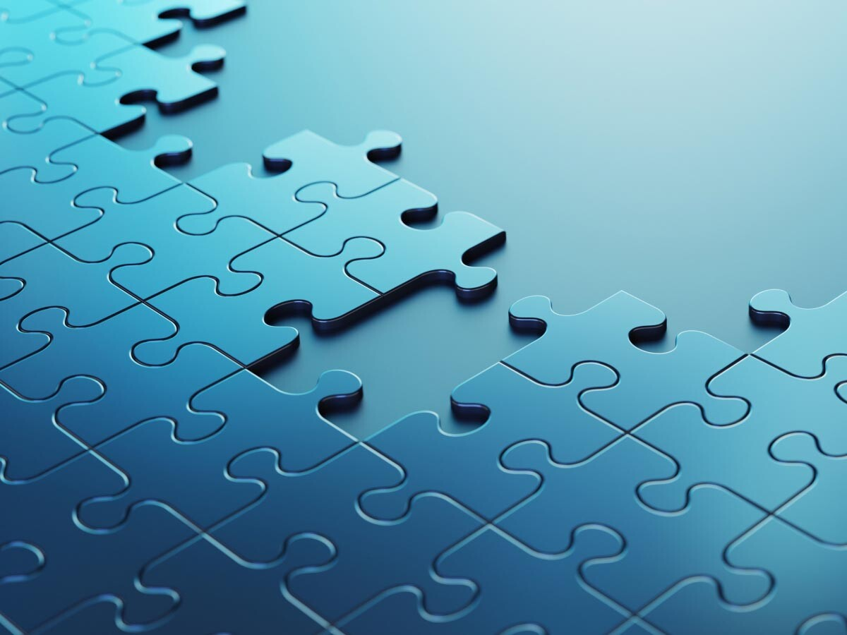 Blue puzzle pieces indicating the complexity of getting workforce capacity just right.