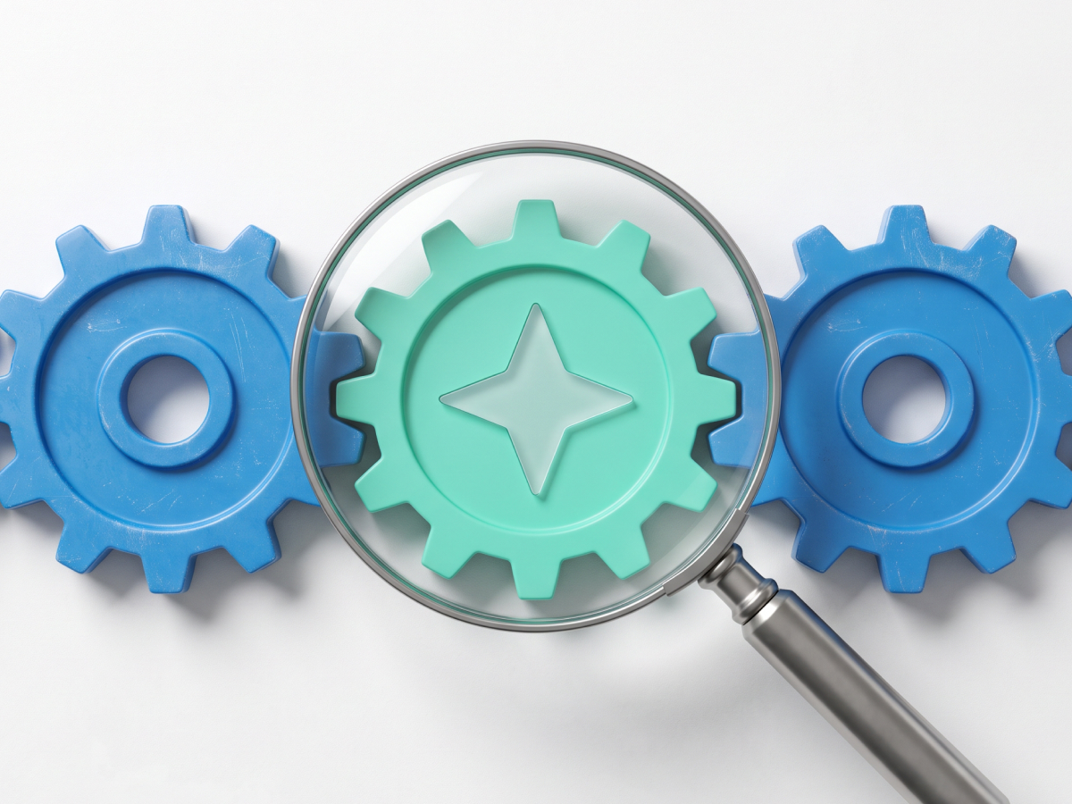 Magnifying glass inspecting process gears for AI workflow improvement.